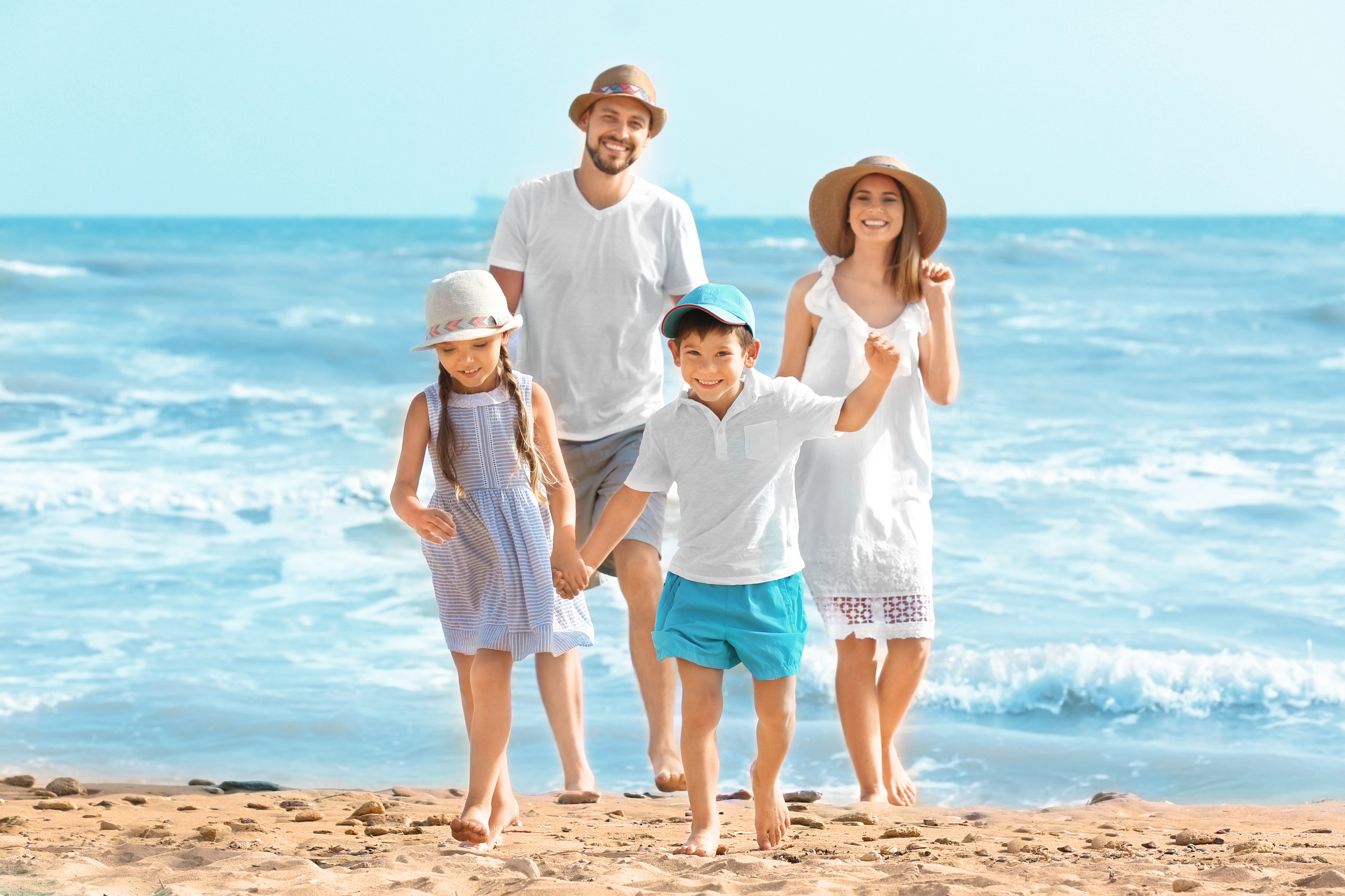 Happy Family on Sea Beach at Resort